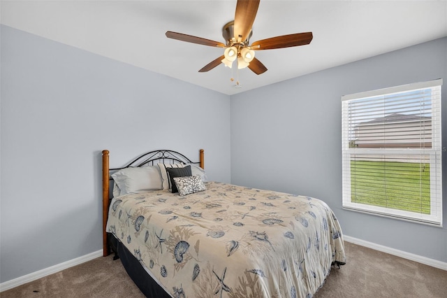 125 Paddock St, Lehigh Acres, FL 33974 - carpeted bedroom with baseboards and a ceiling fan