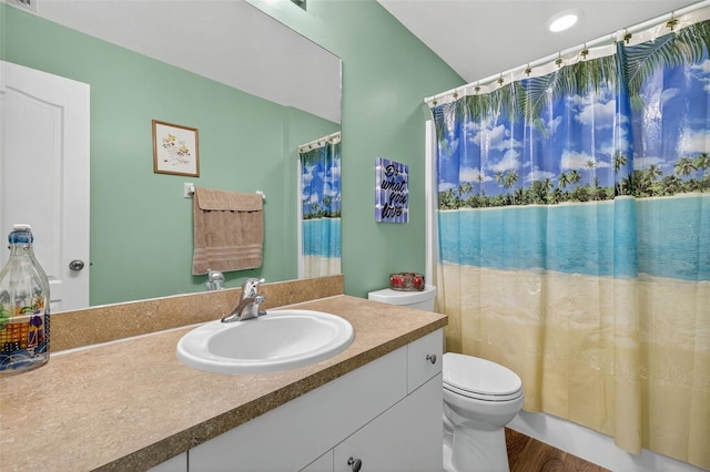 125 Paddock St, Lehigh Acres, FL 33974 - bathroom featuring vanity, a shower with shower curtain, and wood finished floors