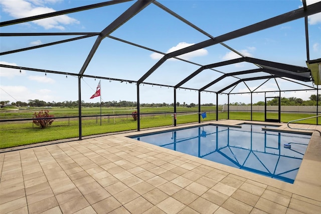 125 Paddock St, Lehigh Acres, FL 33974 - swimming pool with a lawn, a patio area, a view of rural / pastoral area, and glass enclosure
