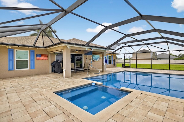 125 Paddock St, Lehigh Acres, FL 33974 - view of swimming pool with a patio, a pool with connected hot tub, ceiling fan, and glass enclosure