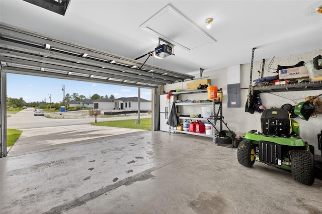 125 Paddock St, Lehigh Acres, FL 33974 - garage with electric panel and a garage door opener