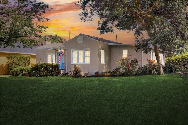 720 Woodward St, Lakeland, FL 33803 - view of front of property featuring a front yard and stucco siding