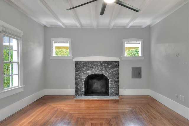 720 Woodward St, Lakeland, FL 33803 - unfurnished living room featuring beamed ceiling, a ceiling fan, and a premium fireplace