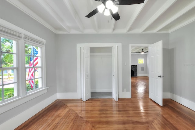 720 Woodward St, Lakeland, FL 33803 - unfurnished bedroom with multiple windows, a fireplace, a closet, and a ceiling fan