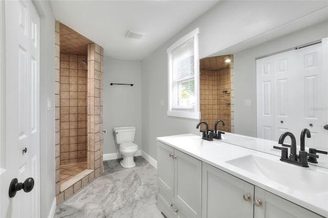 720 Woodward St, Lakeland, FL 33803 - full bathroom with double vanity, a tile shower, and marble finish flooring