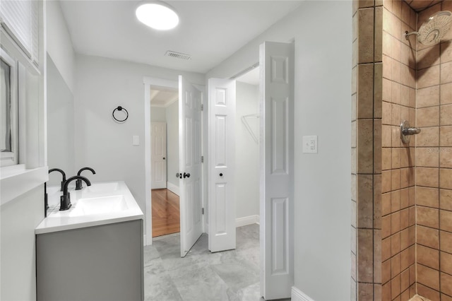 720 Woodward St, Lakeland, FL 33803 - bathroom featuring a stall shower and double vanity