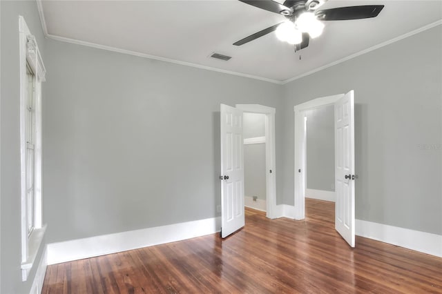 720 Woodward St, Lakeland, FL 33803 - unfurnished bedroom featuring wood finished floors, ornamental molding, and ceiling fan