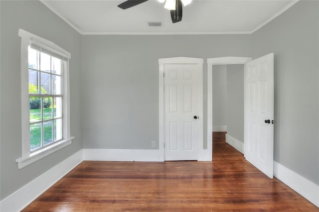 720 Woodward St, Lakeland, FL 33803 - unfurnished bedroom with ornamental molding, wood finished floors, and a ceiling fan