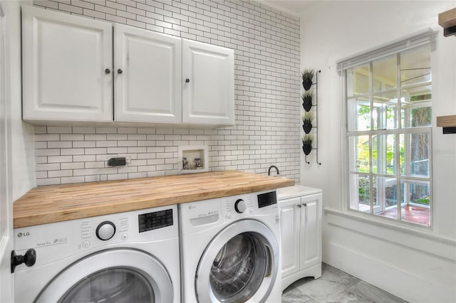 720 Woodward St, Lakeland, FL 33803 - laundry room with cabinet space and washer and dryer