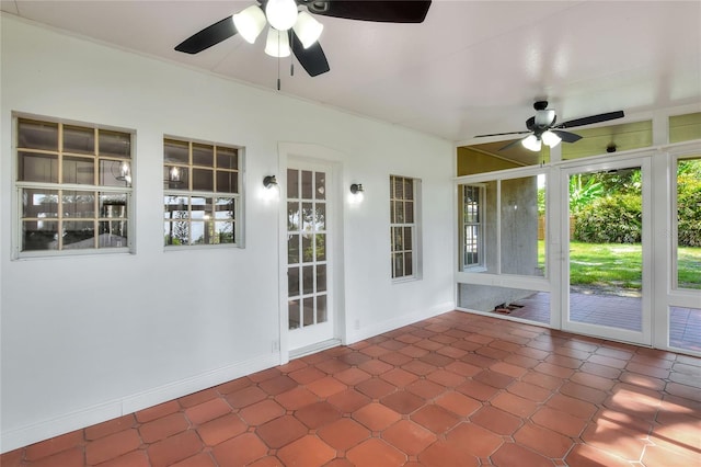 720 Woodward St, Lakeland, FL 33803 - unfurnished sunroom featuring baseboards and tile patterned floors