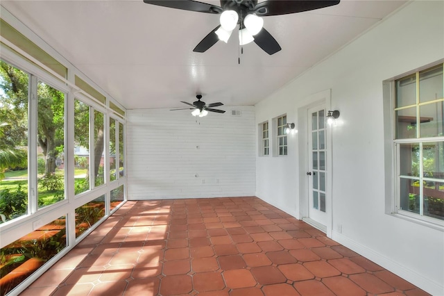 720 Woodward St, Lakeland, FL 33803 - unfurnished sunroom with a ceiling fan and plenty of natural light