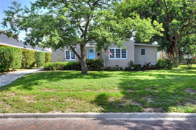 720 Woodward St, Lakeland, FL 33803 - view of front of property with stucco siding and a front yard