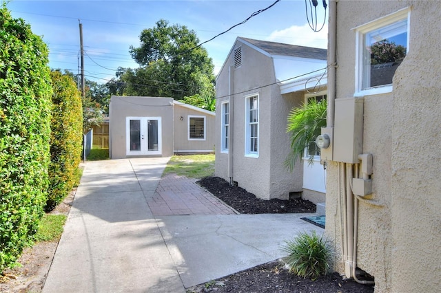 720 Woodward St, Lakeland, FL 33803 - view of home's exterior featuring stucco siding and french doors