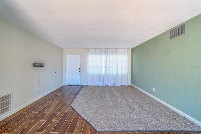 2123 Indigo Dr, Clearwater, FL 33763 - spare room featuring baseboards and dark wood-style floors