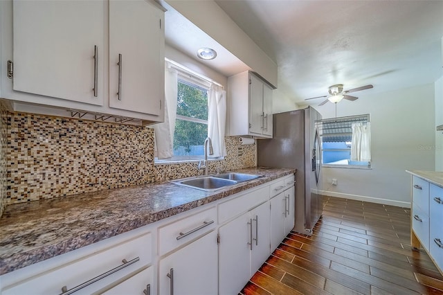 2123 Indigo Dr, Clearwater, FL 33763 - kitchen with a ceiling fan, white cabinets, backsplash, and dark wood finished floors