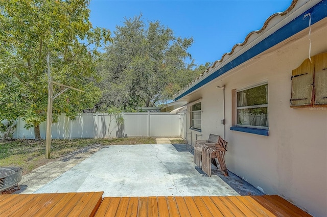 2123 Indigo Dr, Clearwater, FL 33763 - wooden deck featuring a fenced backyard and a patio