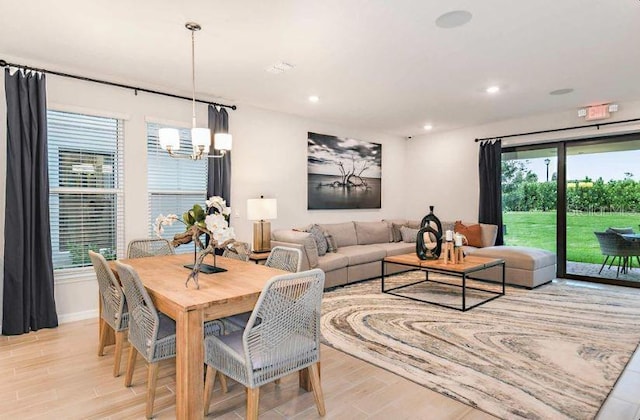 33618 Castaway Loop, Wesley Chapel, FL 33543 - dining space featuring a chandelier, light wood finished floors, and recessed lighting