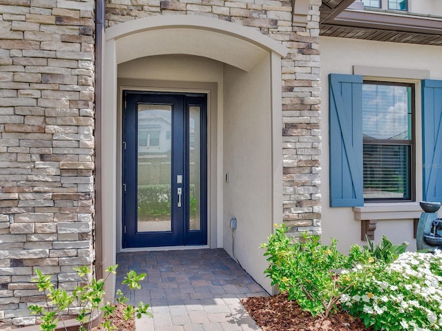 6057 Marsh Trail Dr, Odessa, FL 33556 - entrance to property with stucco siding and stone siding