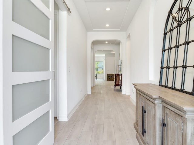 6057 Marsh Trail Dr, Odessa, FL 33556 - hall featuring arched walkways, light wood-style floors, and recessed lighting