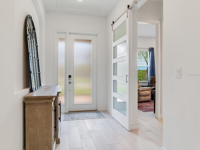 6057 Marsh Trail Dr, Odessa, FL 33556 - foyer with a barn door and french doors
