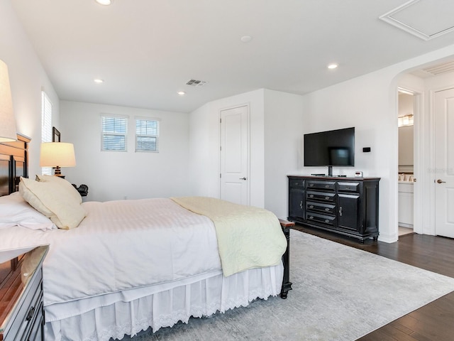 6057 Marsh Trail Dr, Odessa, FL 33556 - bedroom with dark wood finished floors, recessed lighting, and arched walkways