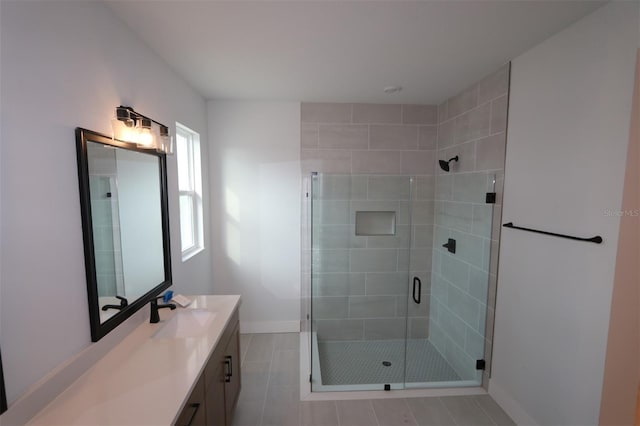 699 Allora Ave, Nokomis, FL 34275 - bathroom featuring vanity, a shower stall, and tile patterned flooring