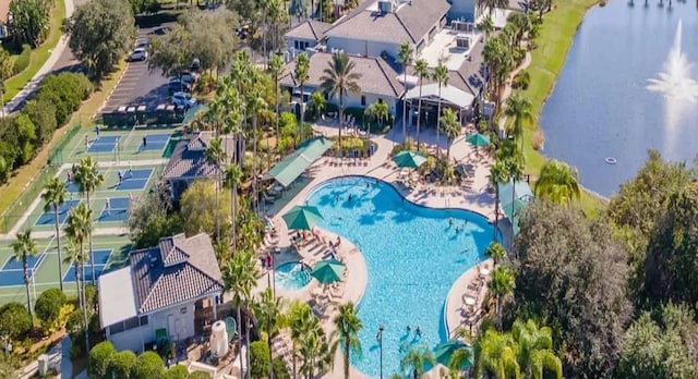 201 Bedford St Unit 79, Sun City Center, FL 33573 - drone / aerial view of a pool and a large body of water