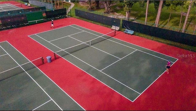 201 Bedford St Unit 79, Sun City Center, FL 33573 - view of tennis court with community basketball court
