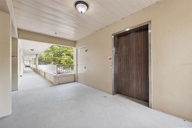 2192 Swedish Dr Unit 26, Clearwater, FL 33763 - doorway to property featuring stucco siding and elevator