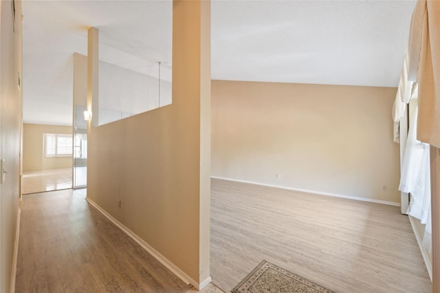 2192 Swedish Dr Unit 26, Clearwater, FL 33763 - hallway featuring light wood finished floors and baseboards
