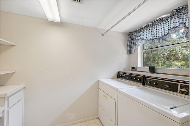 2192 Swedish Dr Unit 26, Clearwater, FL 33763 - laundry area featuring independent washer and dryer and cabinet space