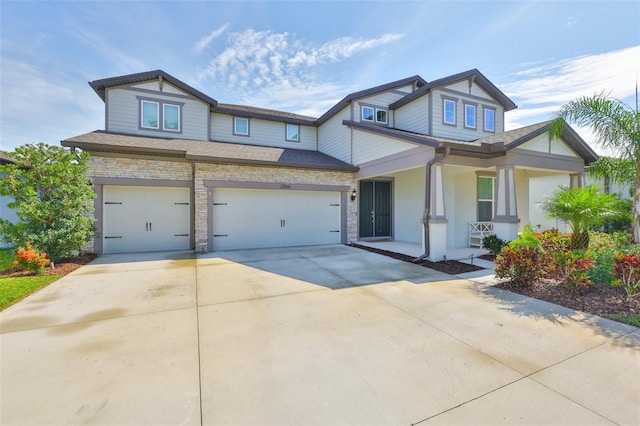 2866 Quail Crest Ct, Valrico, FL 33594 - craftsman-style house with a porch, concrete driveway, a garage, a shingled roof, and stone siding