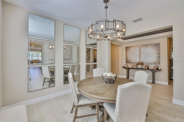 2866 Quail Crest Ct, Valrico, FL 33594 - dining room with a chandelier and wood finished floors