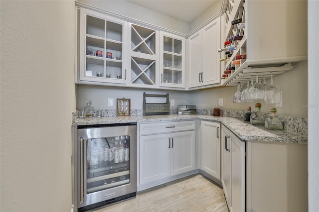2866 Quail Crest Ct, Valrico, FL 33594 - indoor dry bar with wine cooler and light wood-type flooring