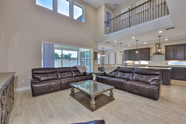 2866 Quail Crest Ct, Valrico, FL 33594 - living area with light wood-style floors, healthy amount of natural light, and a high ceiling