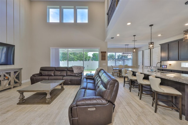 2866 Quail Crest Ct, Valrico, FL 33594 - living room featuring a high ceiling, light wood finished floors, and recessed lighting