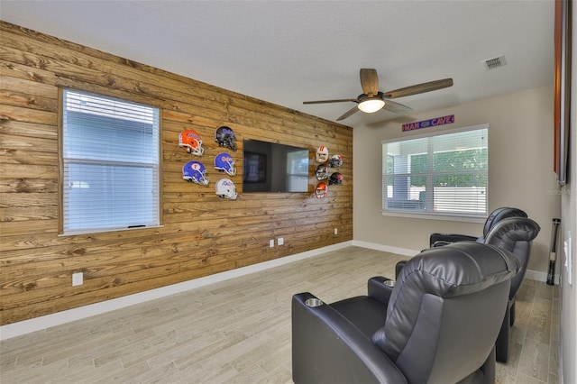 2866 Quail Crest Ct, Valrico, FL 33594 - sitting room featuring wooden walls, ceiling fan, and wood finished floors