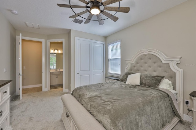2866 Quail Crest Ct, Valrico, FL 33594 - bedroom featuring light carpet, multiple windows, connected bathroom, and a closet