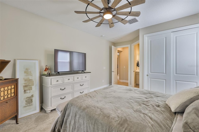 2866 Quail Crest Ct, Valrico, FL 33594 - bedroom featuring light carpet, a closet, and a ceiling fan