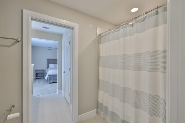 2866 Quail Crest Ct, Valrico, FL 33594 - bathroom with tile patterned flooring and a shower with shower curtain