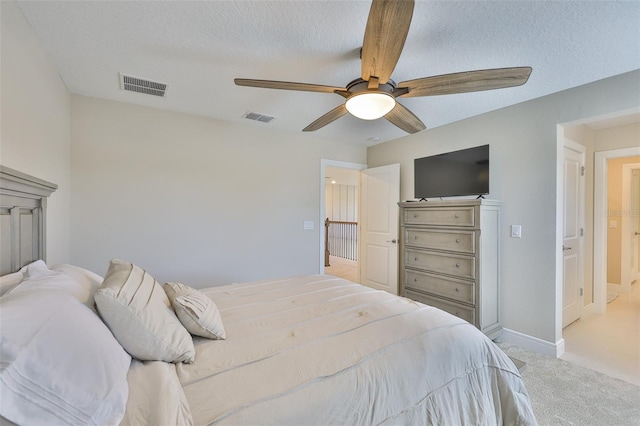 2866 Quail Crest Ct, Valrico, FL 33594 - bedroom featuring light colored carpet, a ceiling fan, and a textured ceiling
