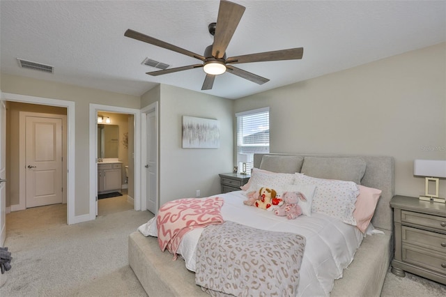 2866 Quail Crest Ct, Valrico, FL 33594 - bedroom featuring light carpet, connected bathroom, and a ceiling fan