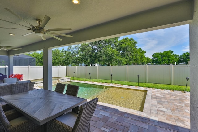 2866 Quail Crest Ct, Valrico, FL 33594 - fenced backyard featuring a ceiling fan, a patio, and outdoor dining space