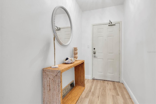 602 Lime Ave Unit 102, Clearwater, FL 33756 - entrance foyer featuring light wood-style flooring and baseboards