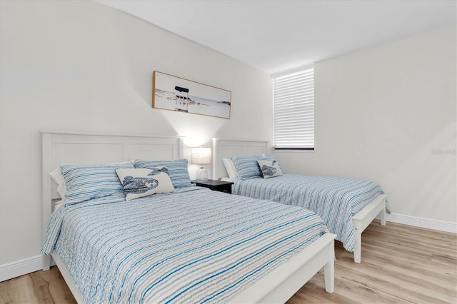 602 Lime Ave Unit 102, Clearwater, FL 33756 - bedroom with light wood-style floors and baseboards