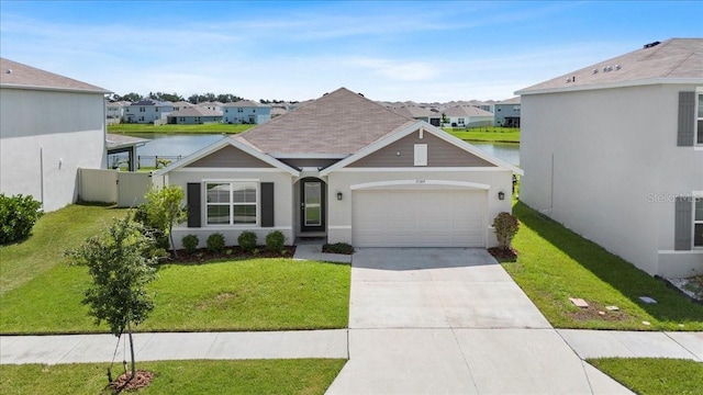 33369 Hamilton Hill Ln, Wesley Chapel, FL 33545 - view of front facade featuring an attached garage, a residential view, concrete driveway, and a front lawn