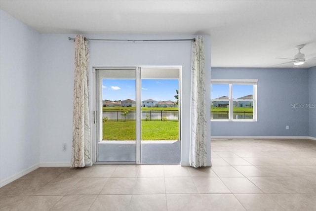 33369 Hamilton Hill Ln, Wesley Chapel, FL 33545 - tiled spare room with ceiling fan and a water view