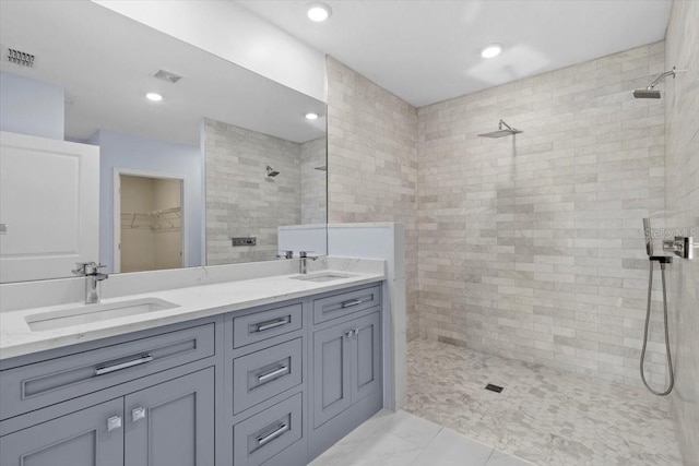 33369 Hamilton Hill Ln, Wesley Chapel, FL 33545 - full bath with walk in shower, double vanity, a walk in closet, and recessed lighting