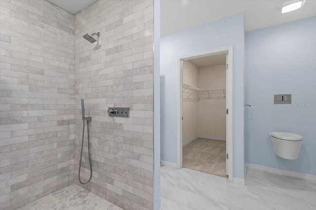 33369 Hamilton Hill Ln, Wesley Chapel, FL 33545 - full bathroom featuring a tile shower, a walk in closet, and marble finish flooring