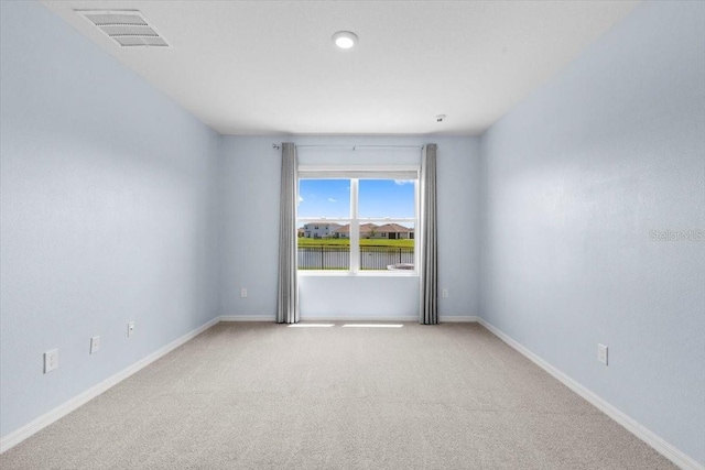 33369 Hamilton Hill Ln, Wesley Chapel, FL 33545 - empty room with light colored carpet and baseboards